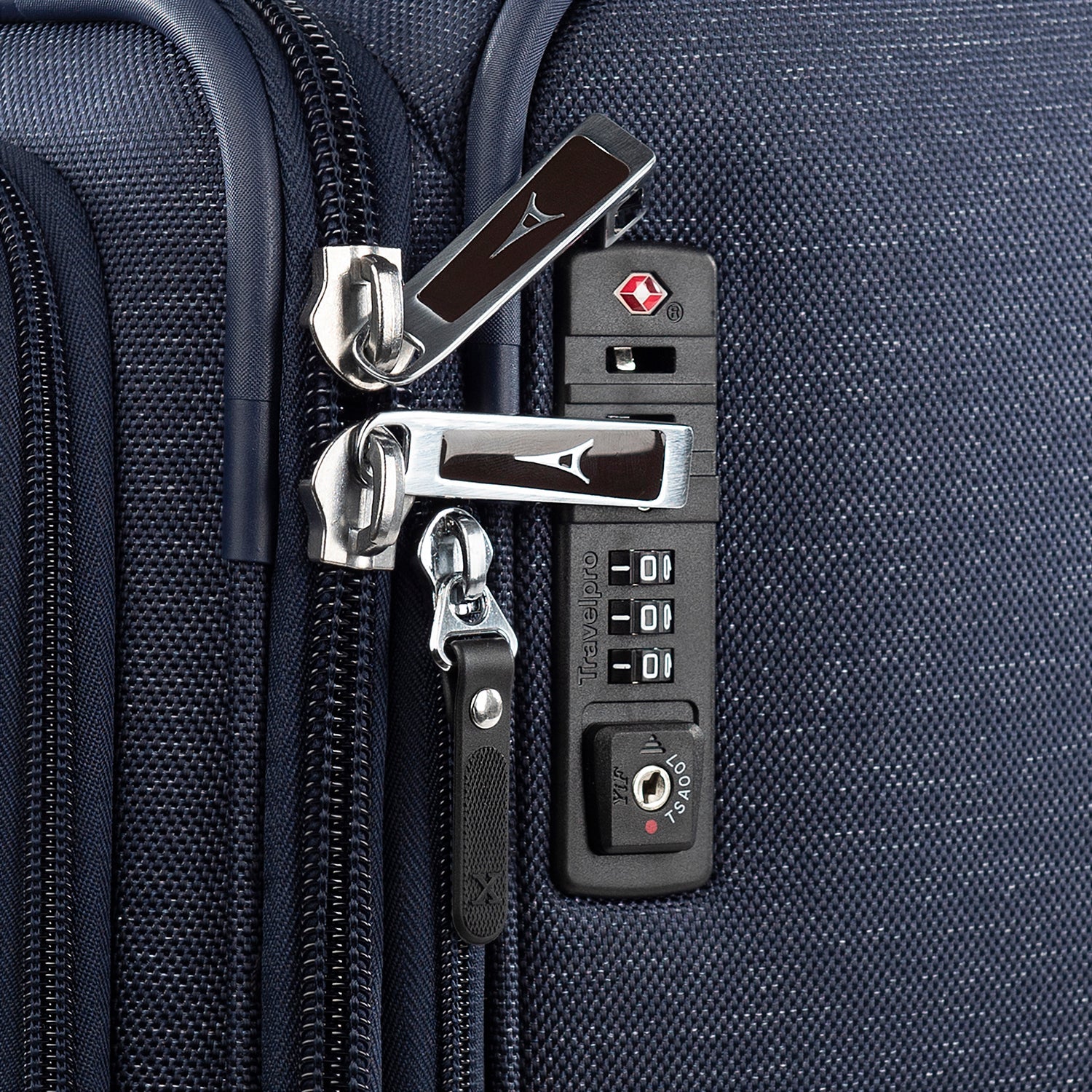 Close-up of a suitcase's zipper and lock mechanism.