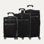 Set of three black suitcases of different sizes on a white background