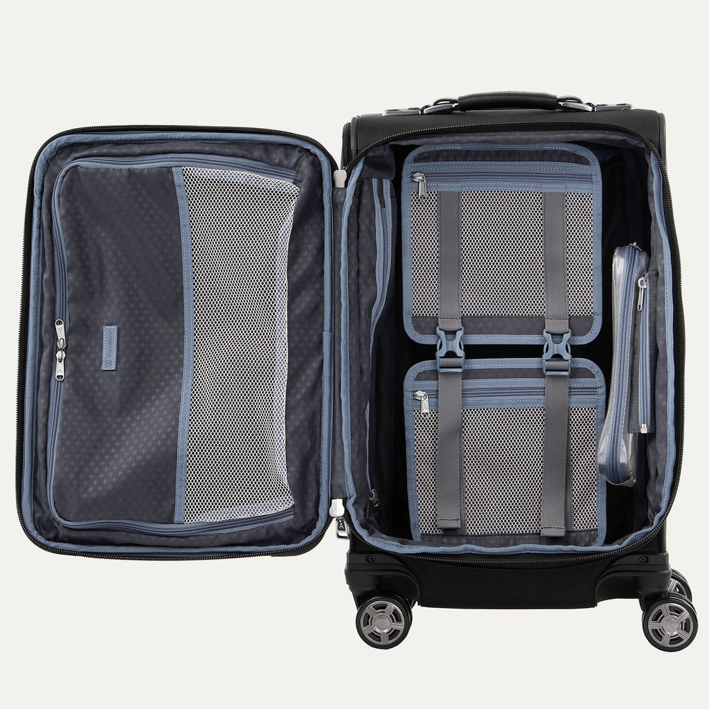 Open suitcase with organized compartments on a white background