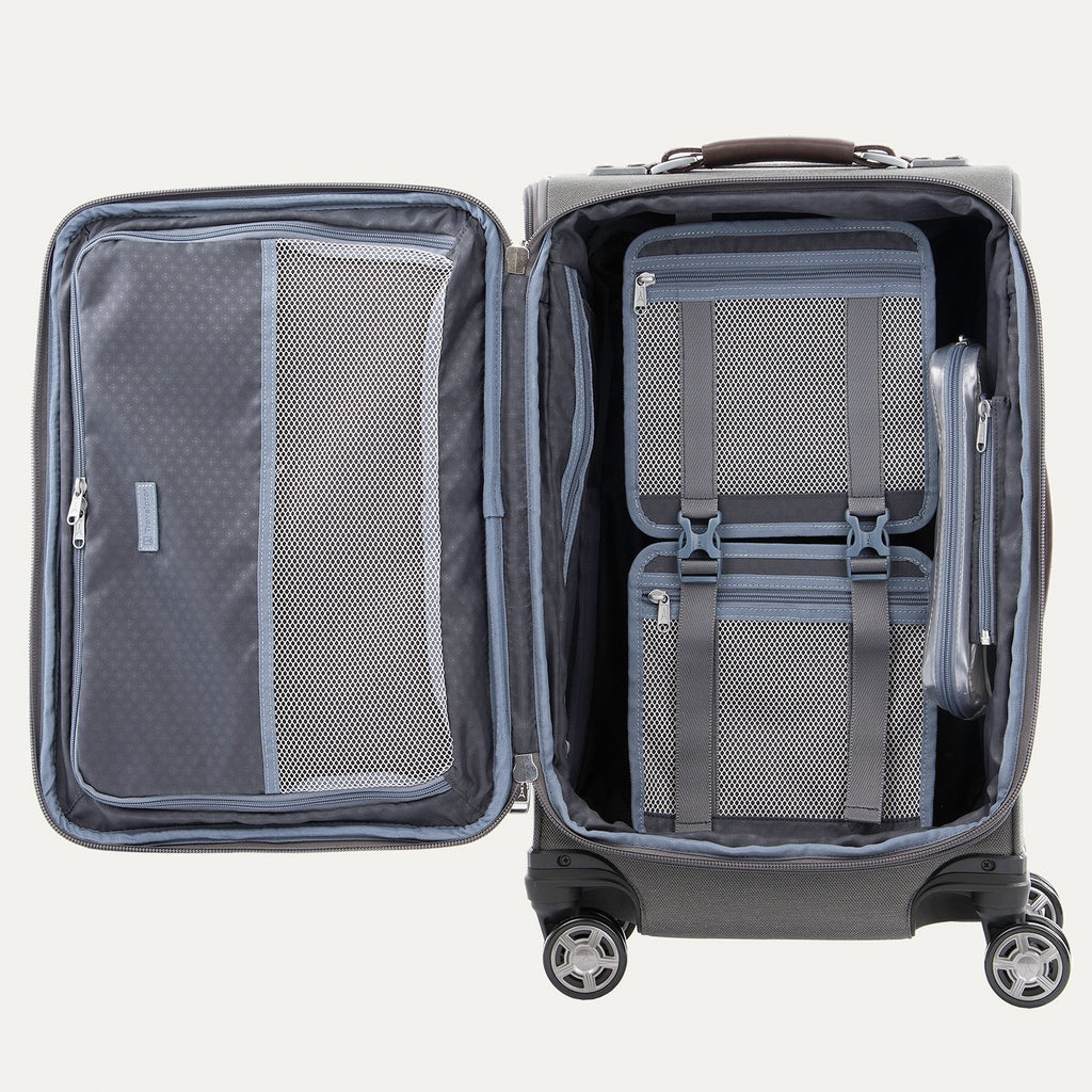 Open suitcase with interior organization panels on a white background