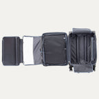 Open suitcase with open suiter compartment on a white background