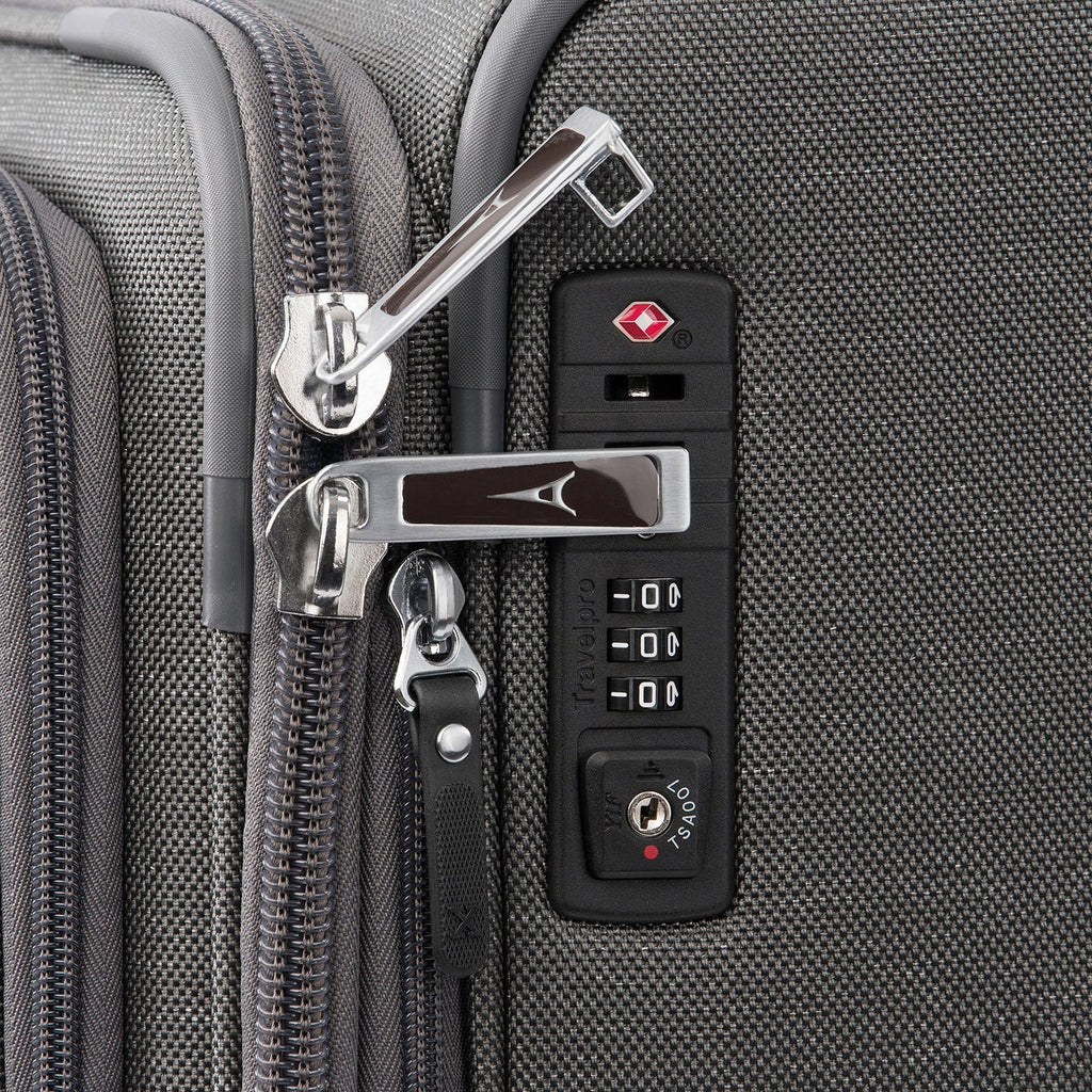 Close-up of a suitcase zipper and lock mechanism.