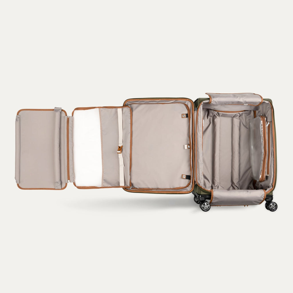 Open suitcase with organized compartments on a white background