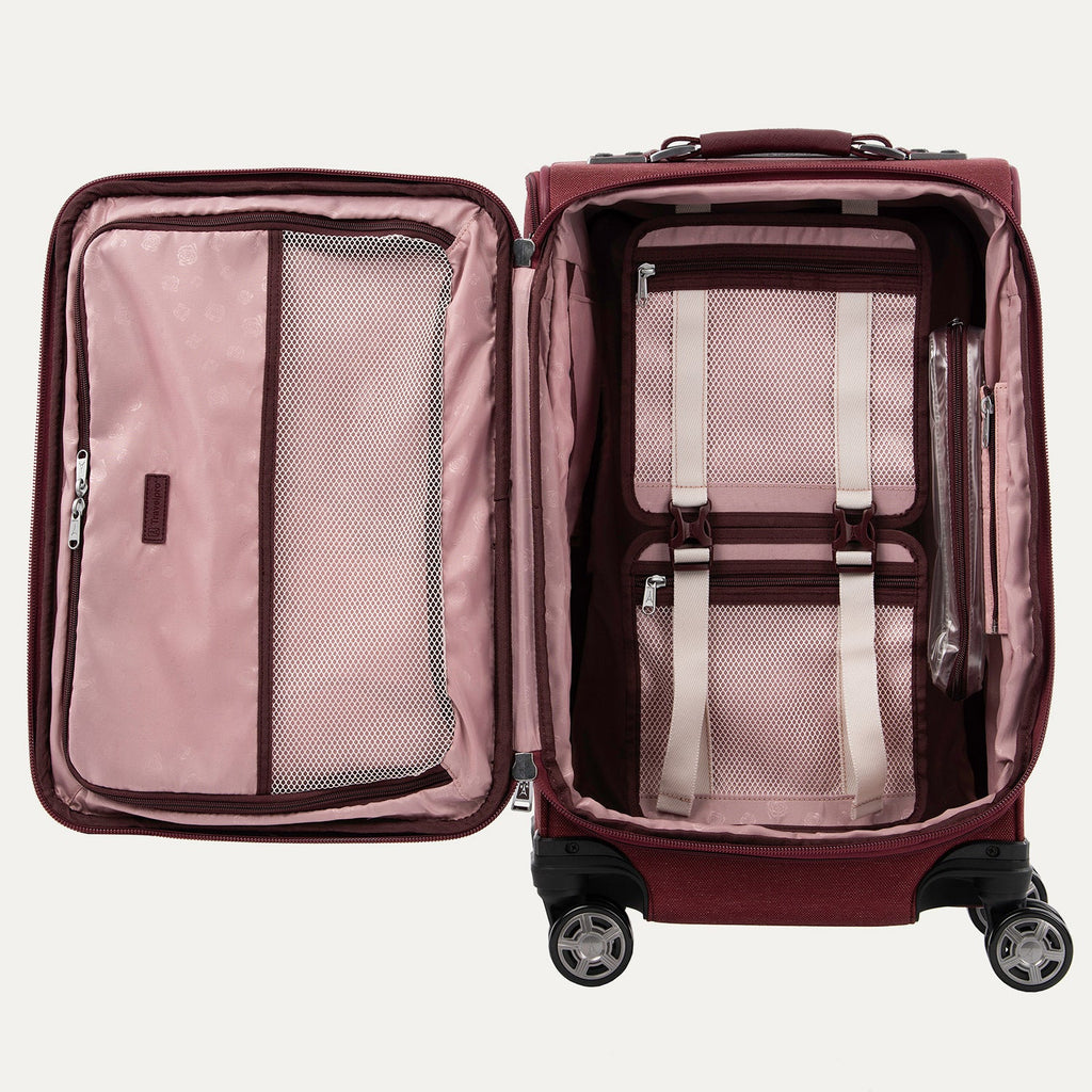 Open red suitcase with organized interior compartments on a white background