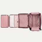 Pink suitcase with compartments open on a white background
