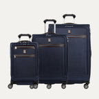 A set of three navy blue Platinum Elite spinner luggage bags, including a carry-on size, medium size, and large size, with their telescopic handles extended.     