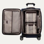 Open suitcase with interior organization shown on a plain background
