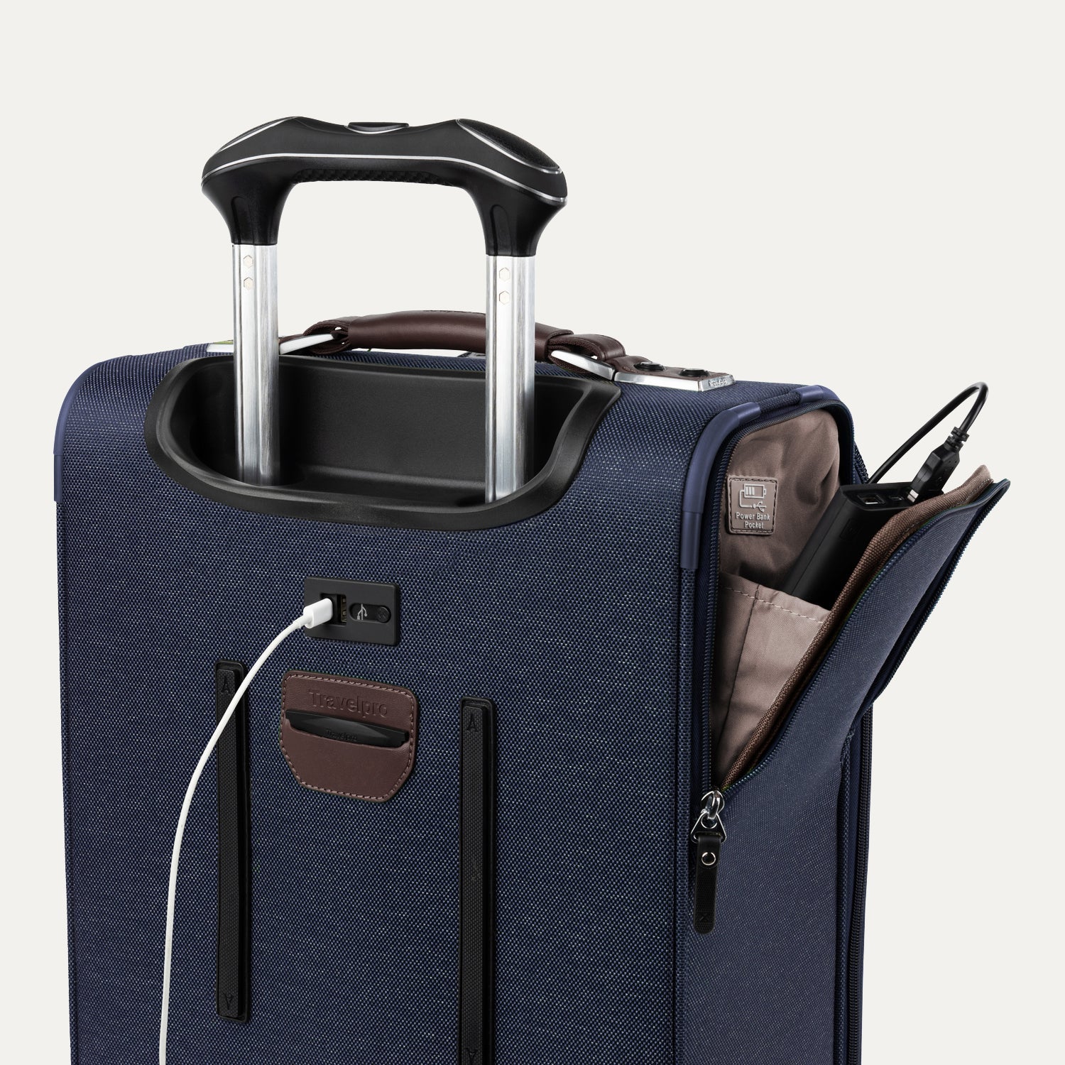 Blue suitcase with USB cable and other accessories visible on a white background