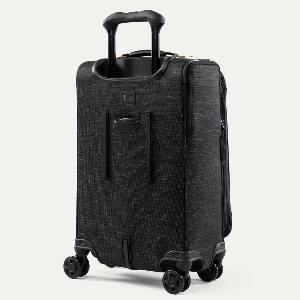 Black suitcase with wheels and handle on a white background