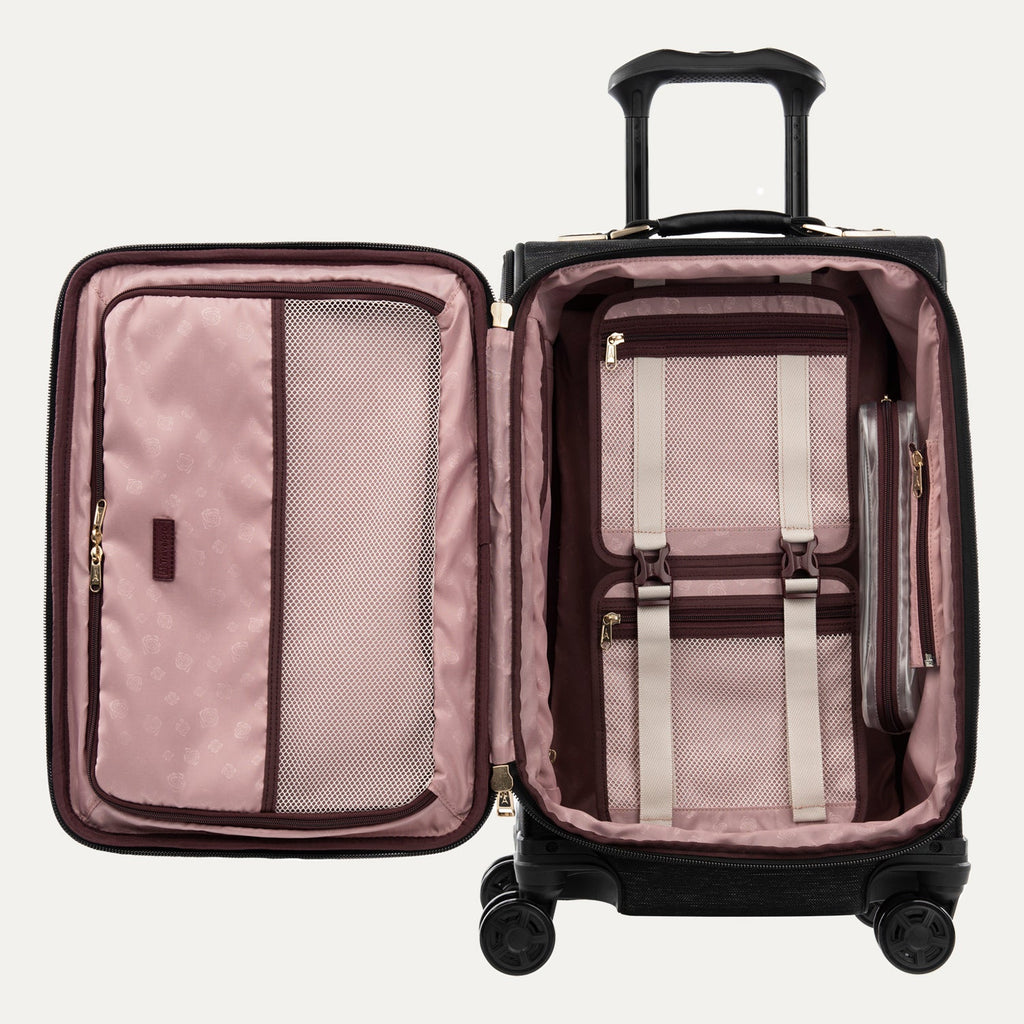 Open suitcase with pink interior and black exterior on a white background