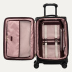 Open suitcase with pink interior and black exterior on a white background