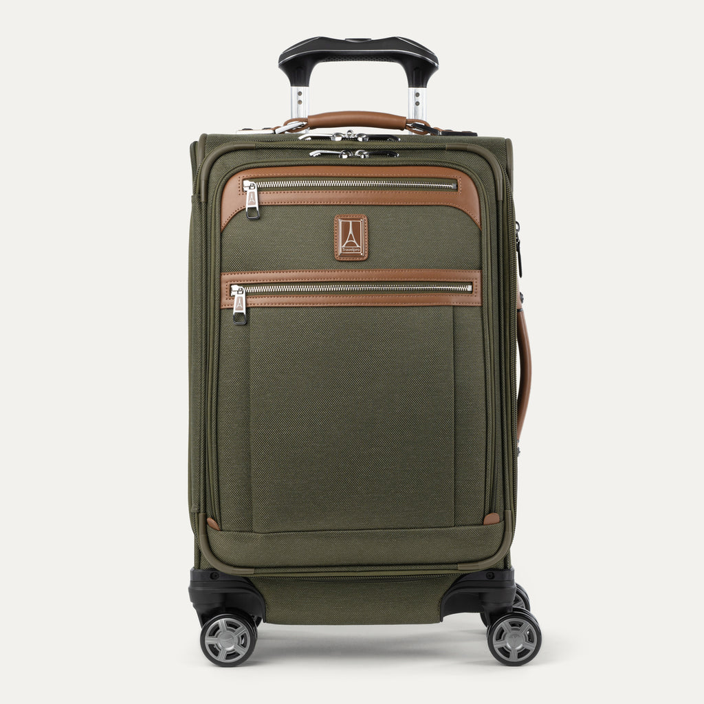 Front view of Travelpro Platinum Elite Carry-On Spinner in Olive Green, with dual front zippered pockets, contrast trim, spinner wheels, and telescoping handle.

