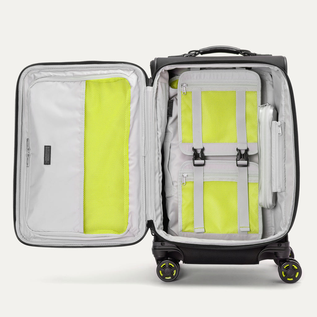 Interior view of the Platinum Elite Neon Shadow Carry-On in black, featuring zippered mesh compartments and adjustable compression straps with signature neon green accents for organized, efficient packing.