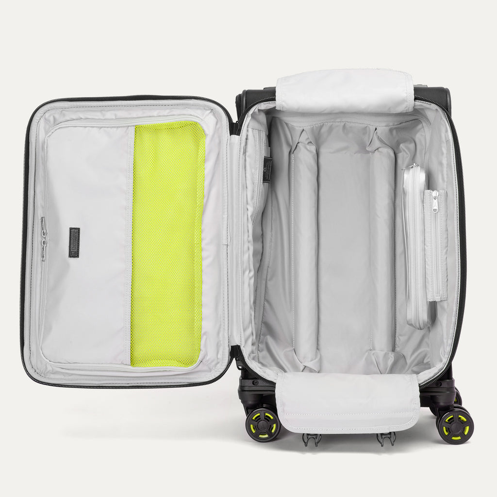 Detailed interior view of the Platinum Elite Neon Shadow Carry-On in black, highlighting the spacious main compartment with zippered mesh pockets and signature neon green compression straps for secure and organized packing.