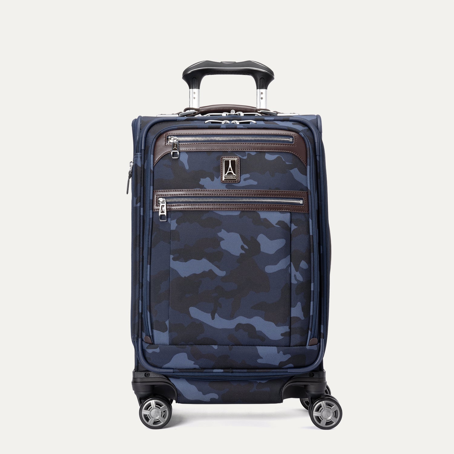A carry-on spinner suitcase with camouflage pattern, featuring a combination lock, chrome zippers, and a precisionglide system.