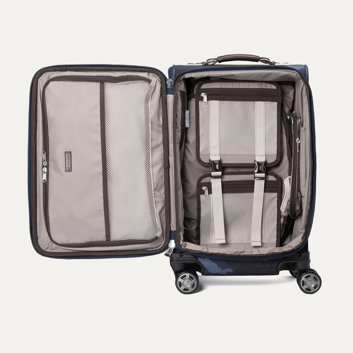  Open view of Platinum® Elite Carry-On Spinner in Camouflage, showing interior with mesh compartments, and adjustable straps.