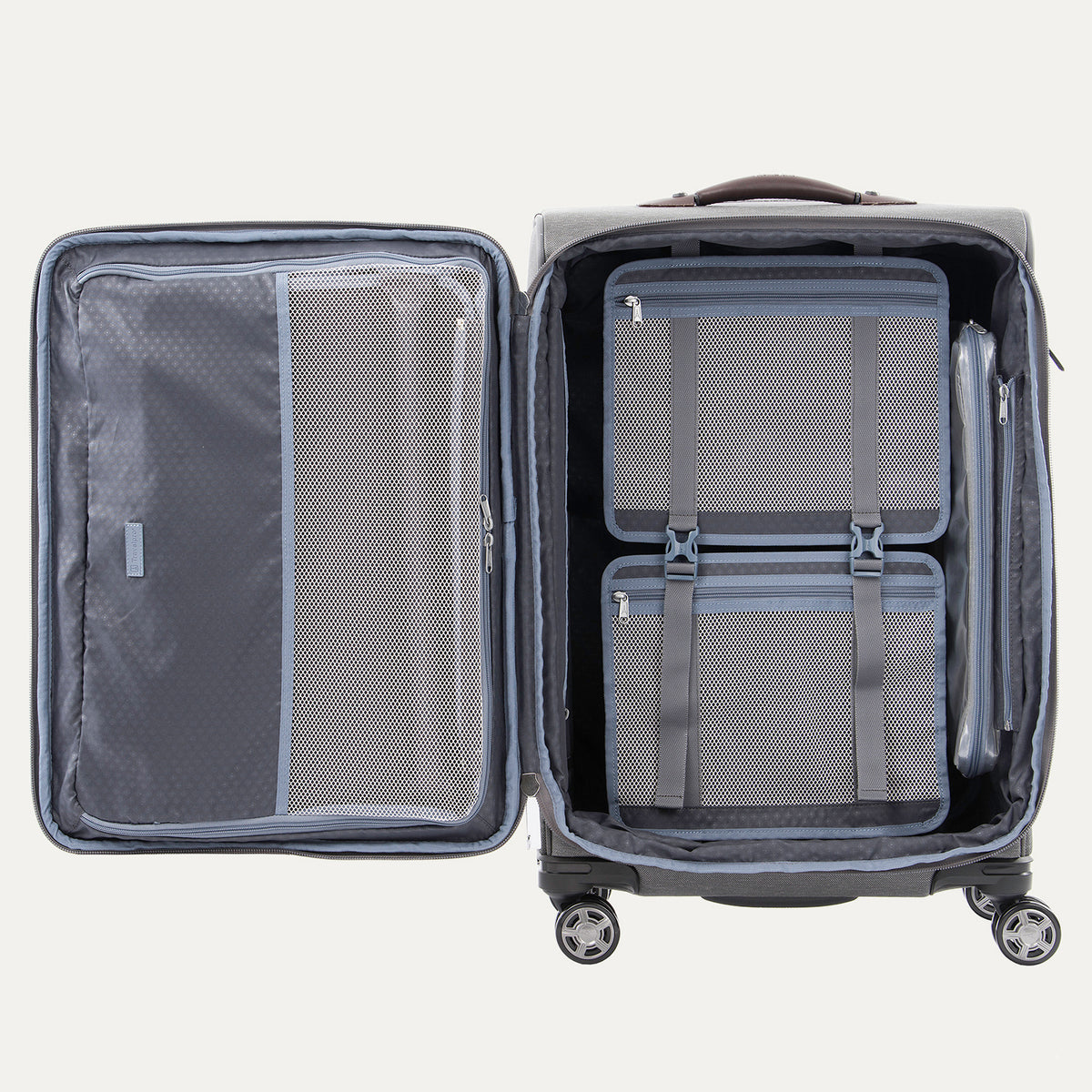Interior view of the Travelpro Platinum Elite Medium Check-In Spinner in Vintage Grey, showcasing the fully open main compartment with zippered mesh dividers and compression packing system.