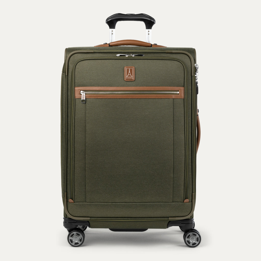 Front-facing Travelpro Platinum Elite Medium Expandable Spinner in Olive Green, with leather trim and spinner wheels.
