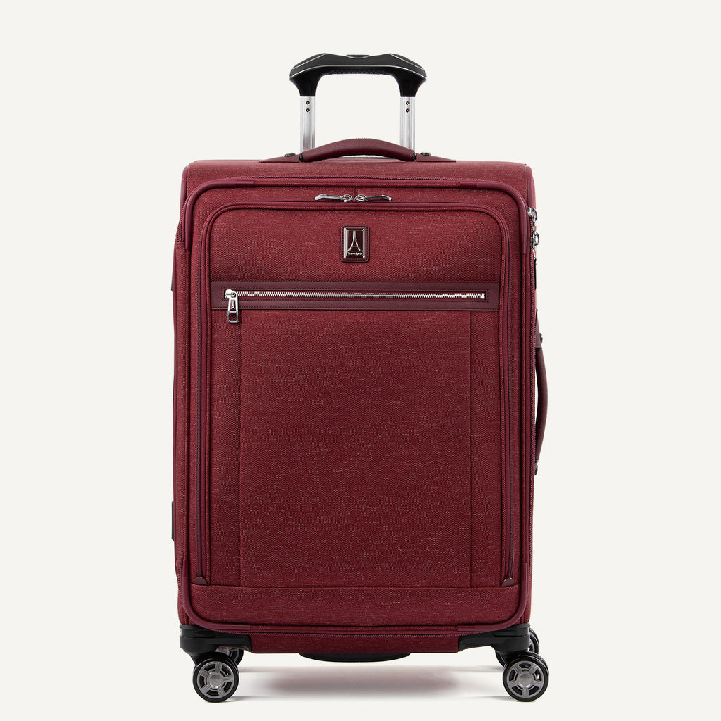 Front-facing Travelpro Platinum Elite Medium Expandable Spinner in Bordeaux, with silver zipper and 360° spinner wheels.