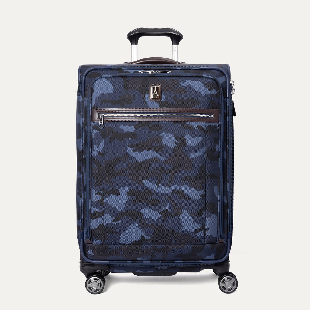 A medium-sized check-in spinner luggage with a camouflage pattern. It has a telescopic handle, spinner wheels, and a built-in TSA lock.