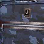 Travelpro logo and front zippered pocket with leather trim on Platinum® Elite Medium Check-In Spinner in Camouflage.

