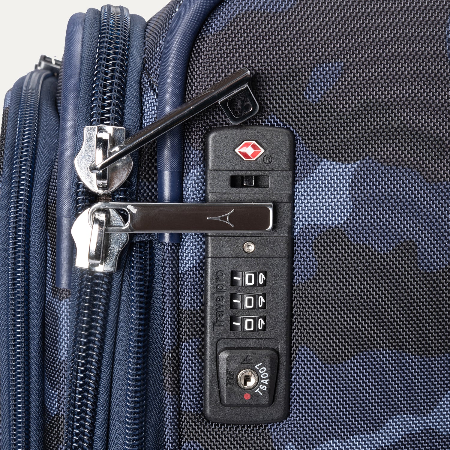 Integrated TSA-approved combination lock on Platinum® Elite Medium Check-In Spinner in Camouflage.