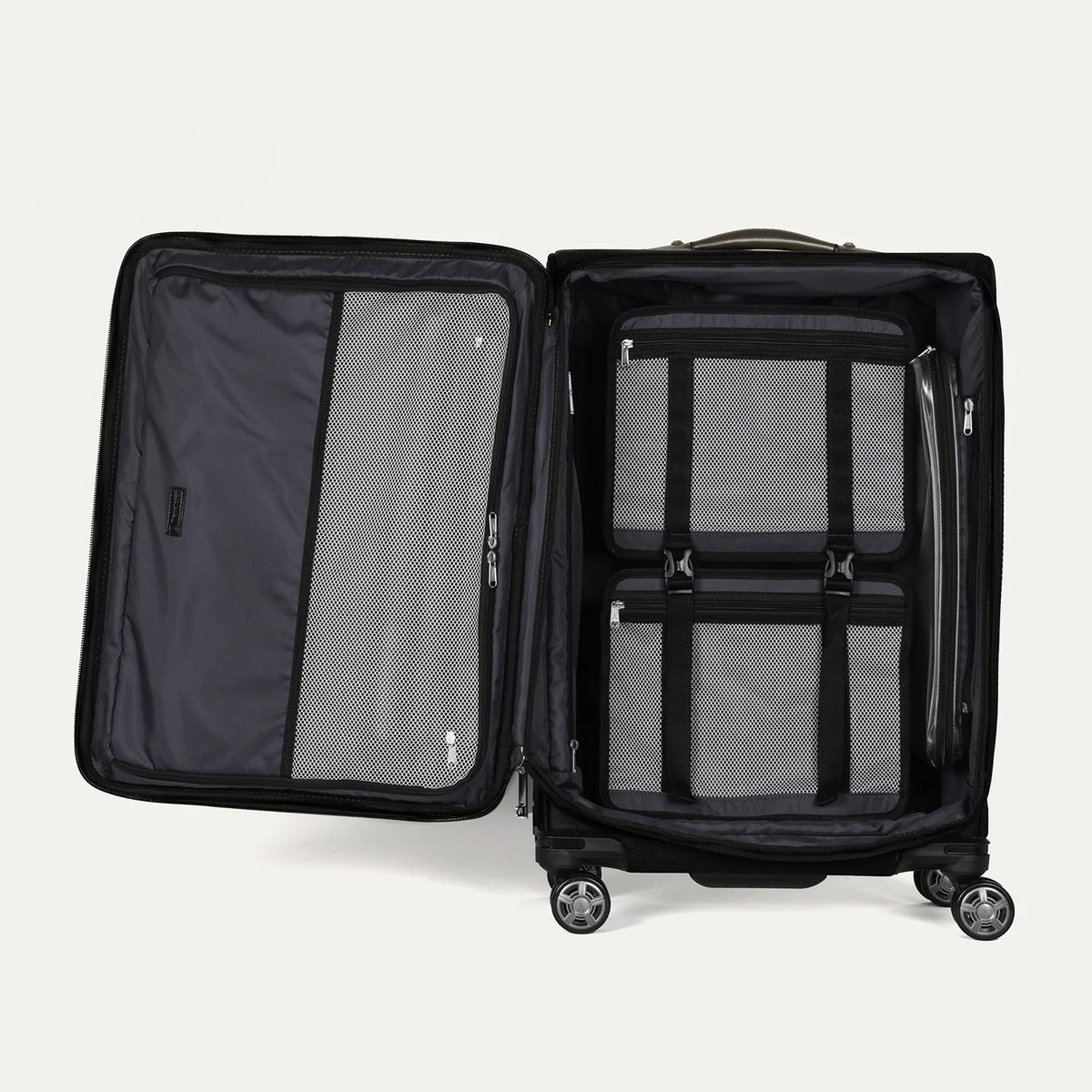 Interior view of the Travelpro Platinum Elite Medium Check-In Spinner in black, featuring zippered mesh compartments and adjustable compression straps for organized, efficient packing.
