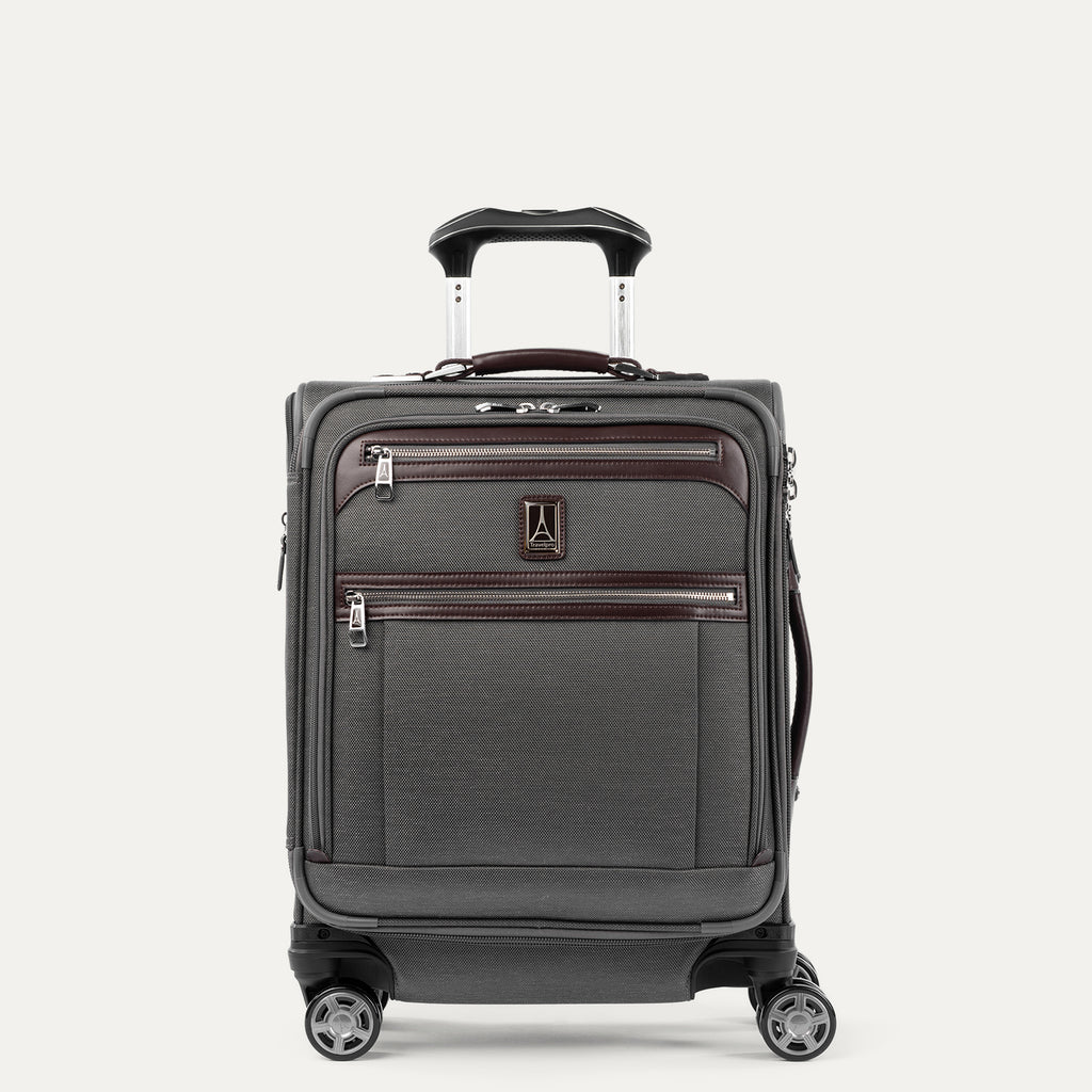 Front view of Travelpro® Platinum Elite International Carry-On Expandable Spinner in Vintage Grey, with dual exterior zip pockets and leather trim.