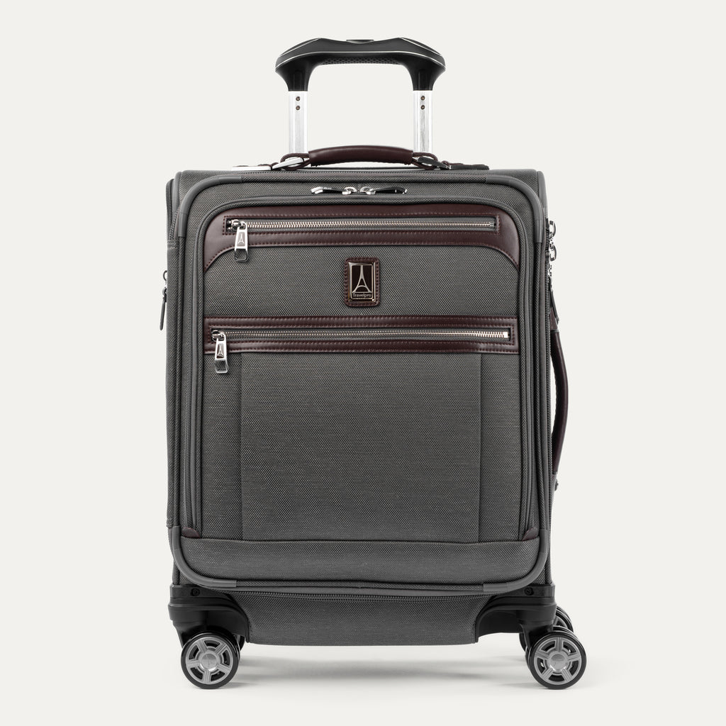Front view of Travelpro® Platinum Elite International Carry-On Expandable Spinner in Vintage Grey, with dual exterior zip pockets and leather trim.
