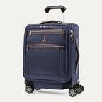 Travelpro® Platinum® Elite International Carry-On Spinner in True Navy, featuring front zippered compartments, leather accents, and 360° spinner wheels.

