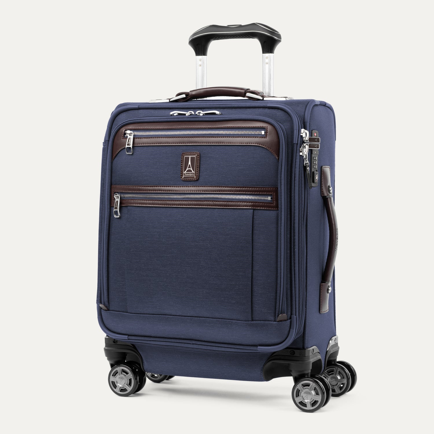 Travelpro® Platinum® Elite International Carry-On Spinner in True Navy, featuring front zippered compartments, leather accents, and 360° spinner wheels.
