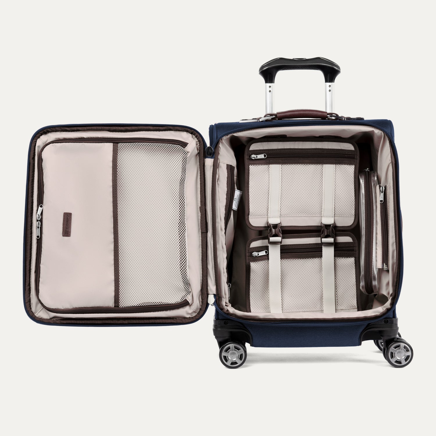 Open view of Travelpro® Platinum® Elite International Carry-On Spinner in True Navy, showing interior mesh pockets and hold-down straps.
