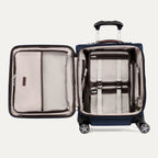 Open view of Travelpro® Platinum® Elite International Carry-On Spinner in True Navy, showing interior mesh pockets and hold-down straps.
