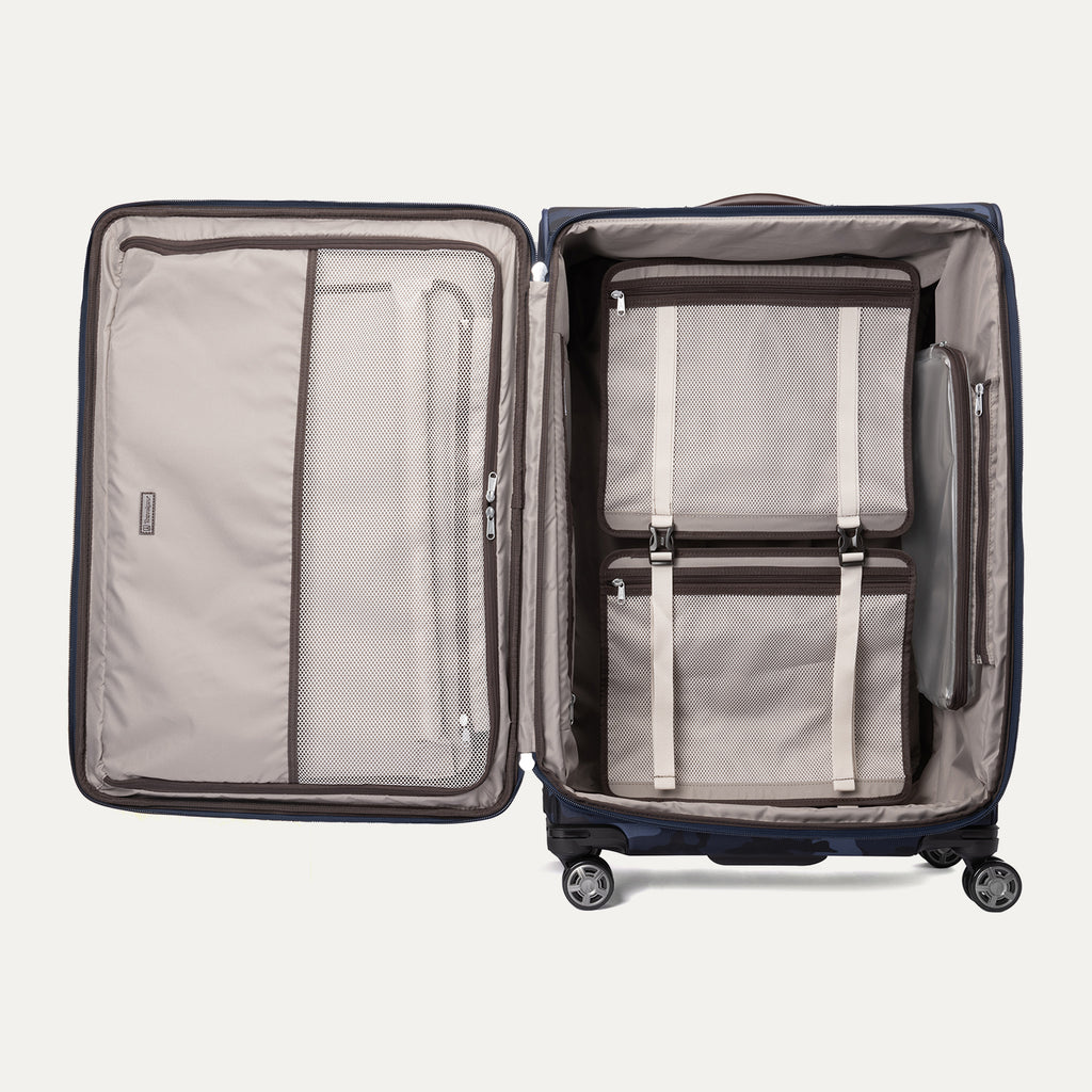  Open Platinum® Elite Large Check-In Spinner in Camouflage displaying organized interior with mesh pockets, packing cubes, and zippered compartments.