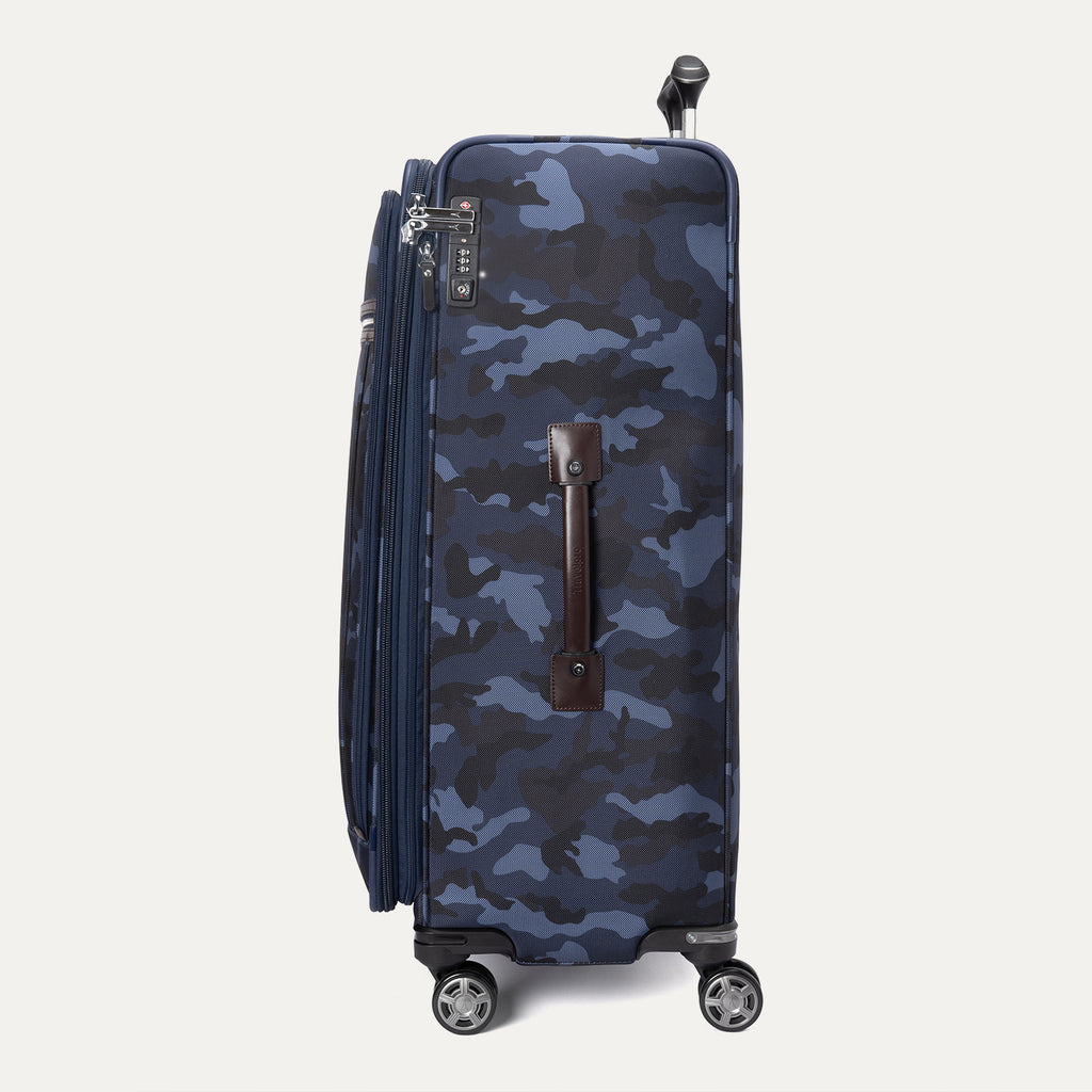 Side view of Platinum® Elite Large Check-In Spinner in Camouflage, showing spinner wheels, side handle, and TSA-approved lock.