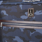  Close-up of the Platinum® Elite Large Check-In Spinner in Camouflage, showcasing the Travelpro logo and front zippered pocket with leather trim.