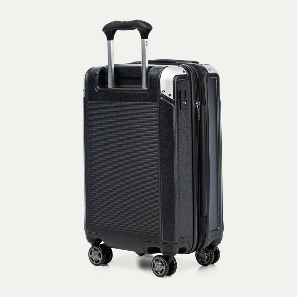 Black suitcase with a textured surface on a white background