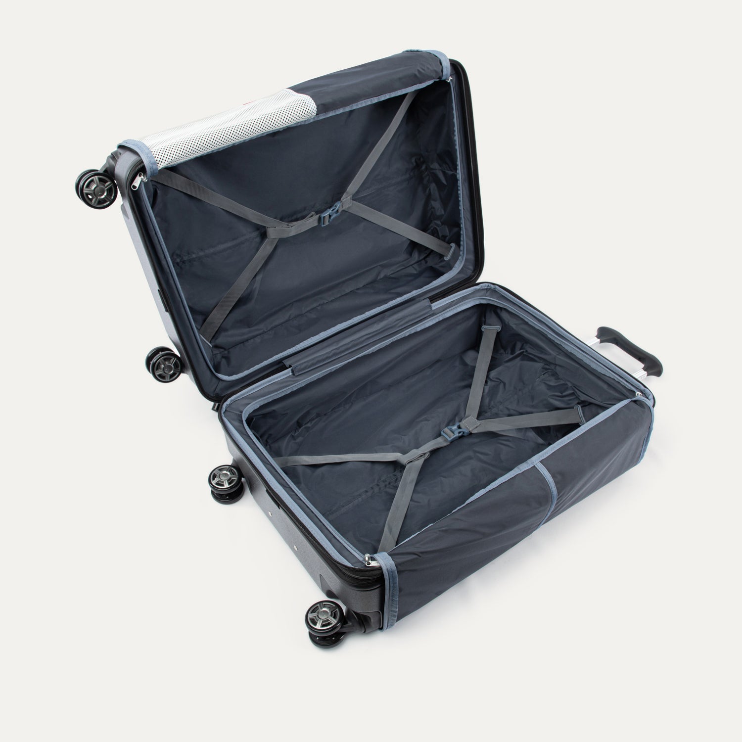 Open suitcase with straps on a white background