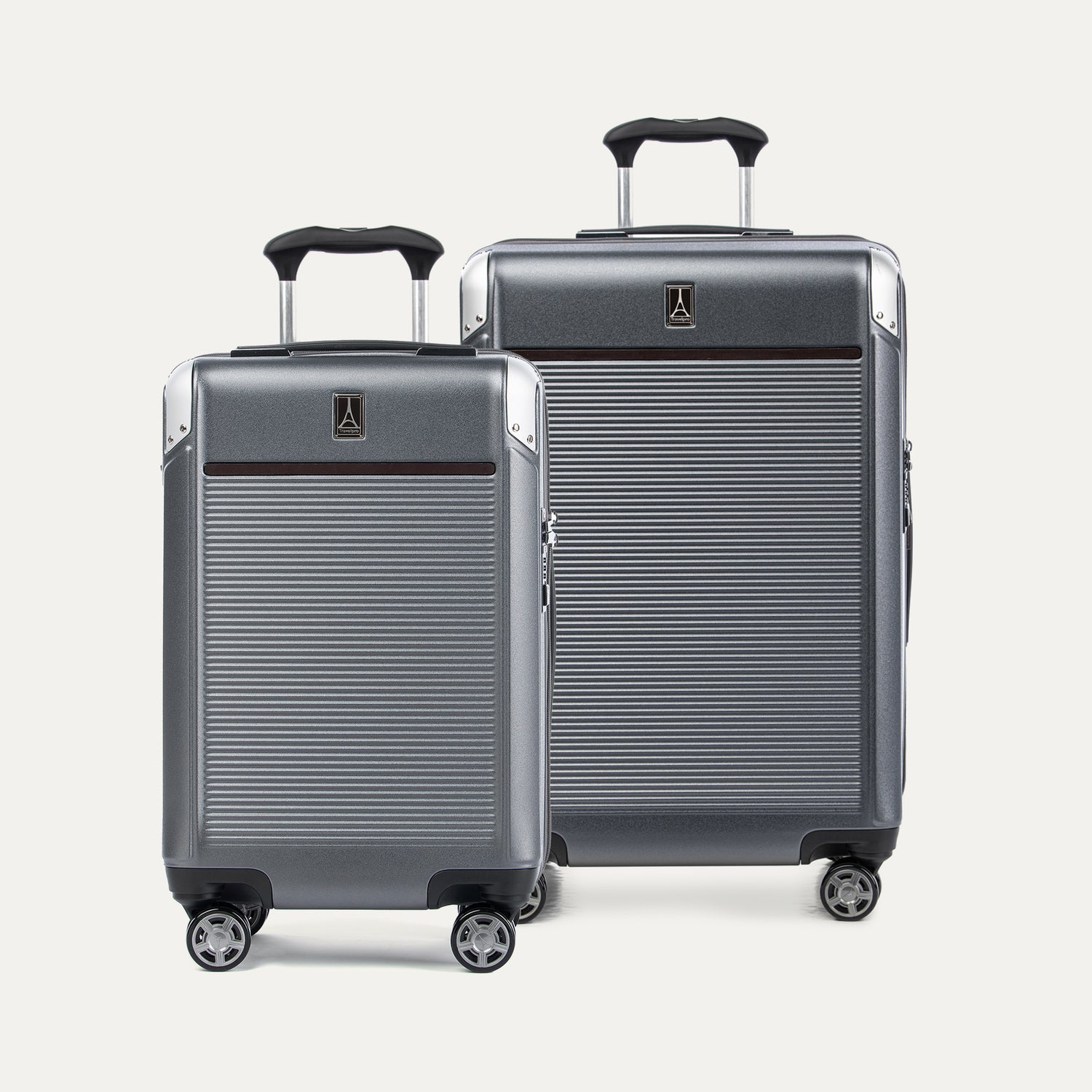 Two gray suitcases with black handles on a white background