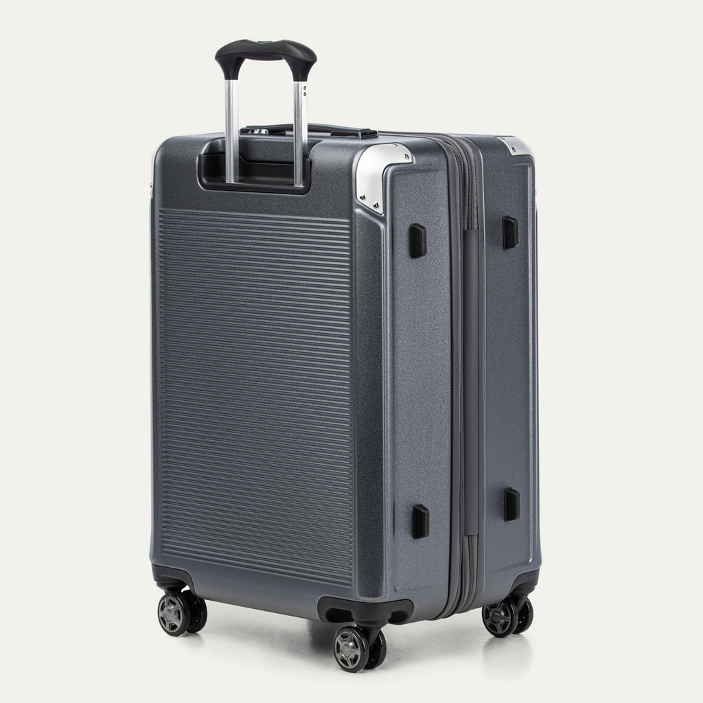 Gray suitcase with black wheels and handle on a white background