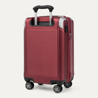 Red suitcase with black handle and wheels on a white background