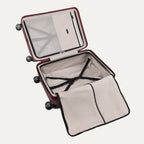 Open suitcase with black wheels on a white background