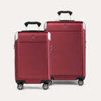 Two red suitcases with black handles on a white background