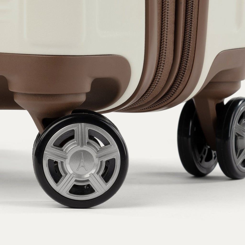 Close-up of suitcase wheels on a white background