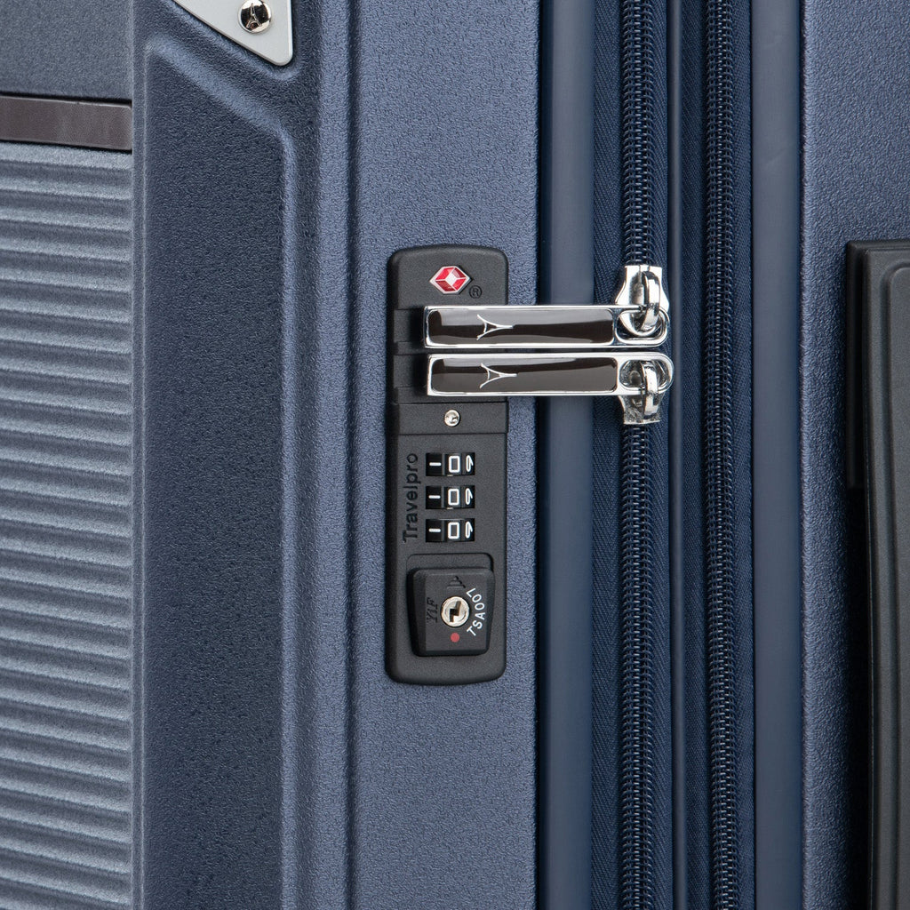 Close-up of a suitcase lock on a blue suitcase.