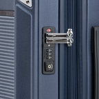 Close-up of a suitcase lock on a blue suitcase.