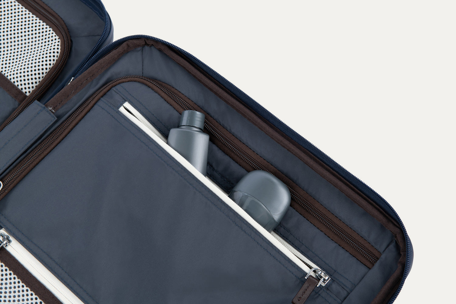 Close-up of a suitcase interior with toiletries inside.