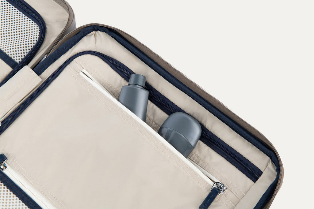 Close-up of a suitcase interior with toiletries inside.