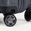 Close-up of a suitcase wheel on a white background