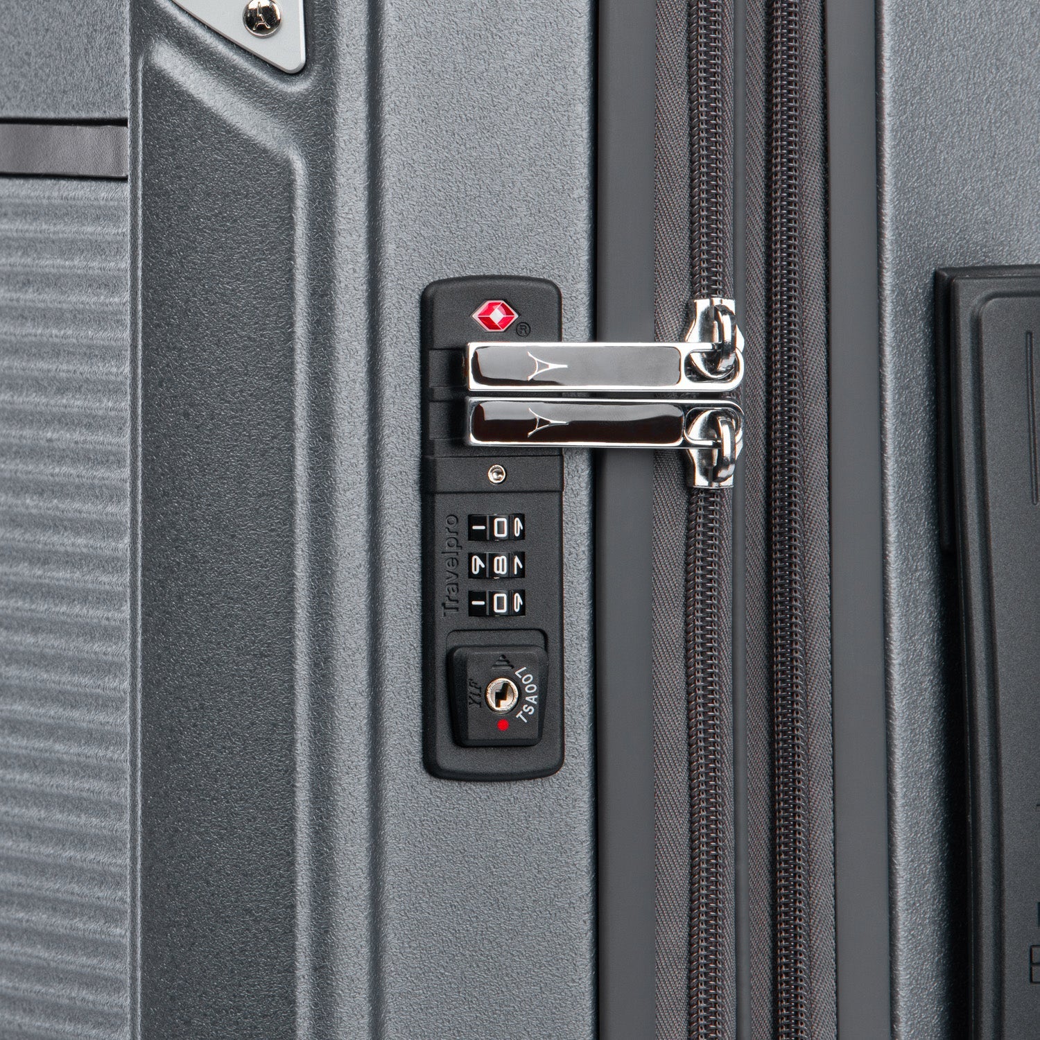 Close-up of a gray suitcase with a combination lock